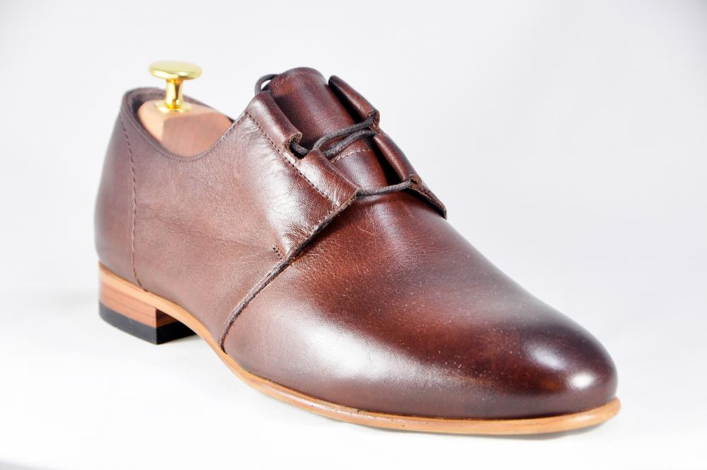 shoes are made of leather preposition