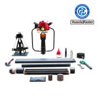 Portable soil drill