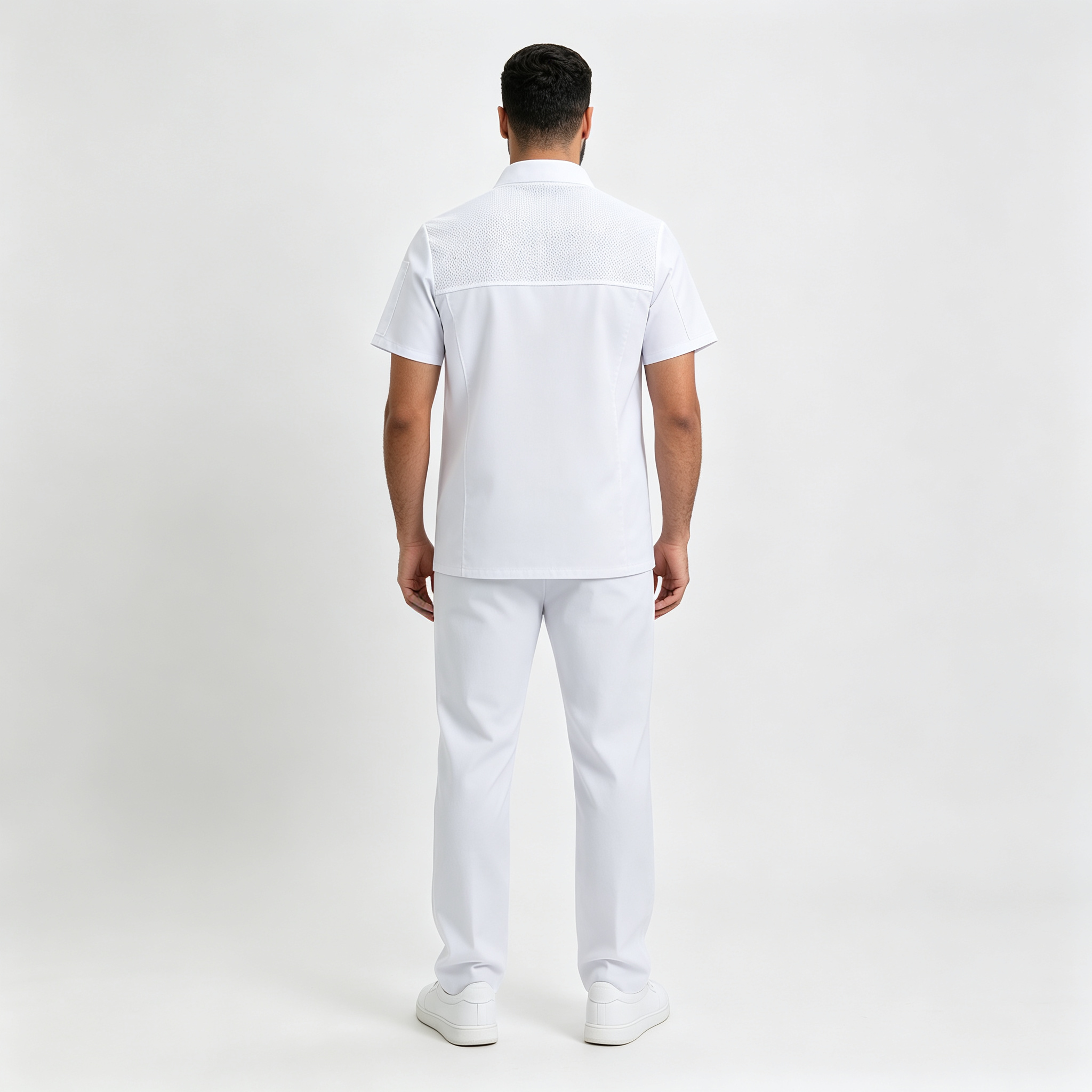 This men’s white short-sleeve chef jacket is designed for professional kitchen environments, hotels, restaurants, catering services, and bulk staff uniform orders. It is made of stretch twill cotton fabric, offering comfort, slight elasticity, durable wear, and a neat professional appearance during long shifts. The chef jacket features a comfortable stand collar, double-breasted snap button closure, chest pocket, side sleeve pocket, and breathable mesh panels on the upper back to improve airflow in hot kitchen conditions. It is suitable for chefs, kitchen staff, hotel restaurants, cafeterias, and catering teams._7